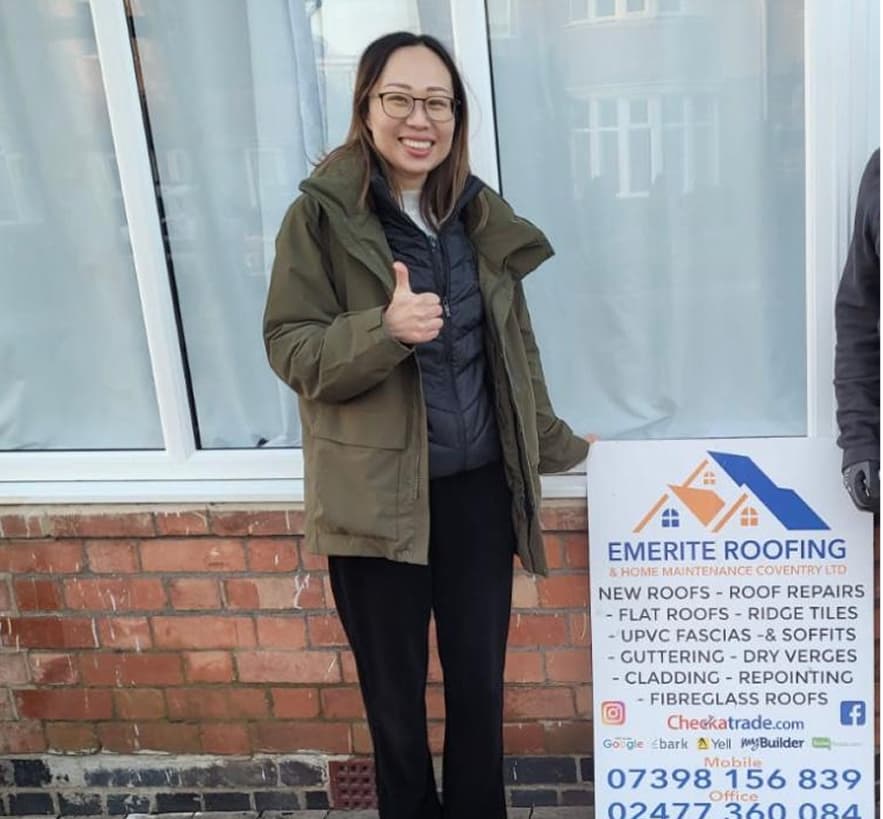 Customer giving a thumbs up after a roofing job